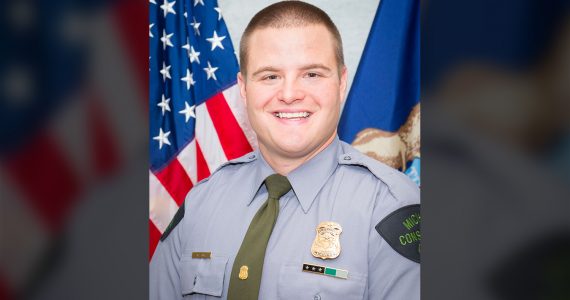 A Michigan Department of Natural Resources Conservation Officer is a hero today after risking his own life to save the life of a swimmer from a strong current.