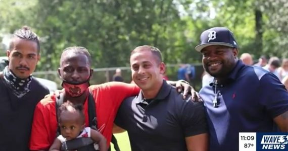 Officer reunites with three men who saved him during a protest in Louisville.