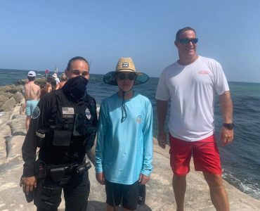 Teen notices man in ocean struggling in current, saves his life